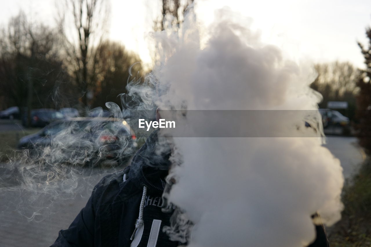 Man with smoke on street