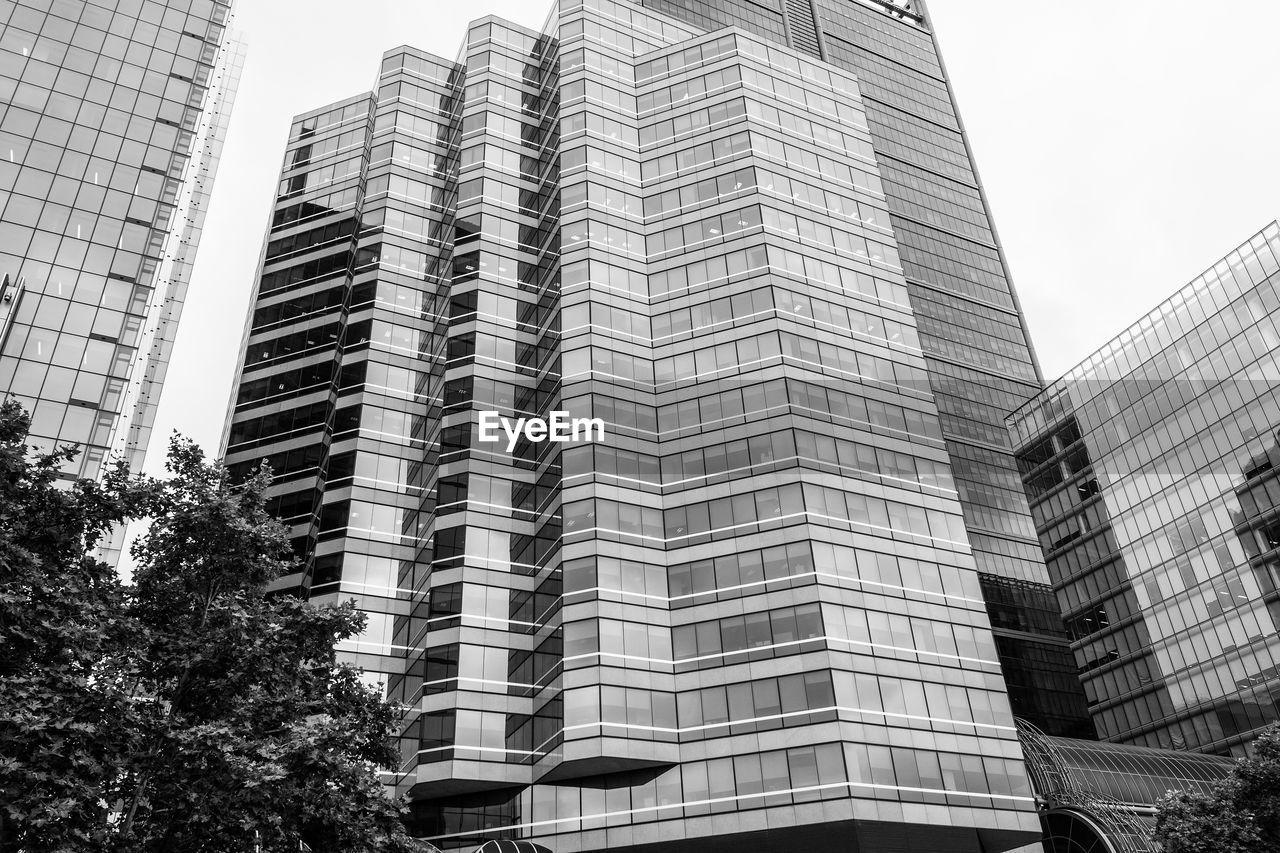 LOW ANGLE VIEW OF BUILDINGS AGAINST SKY IN CITY