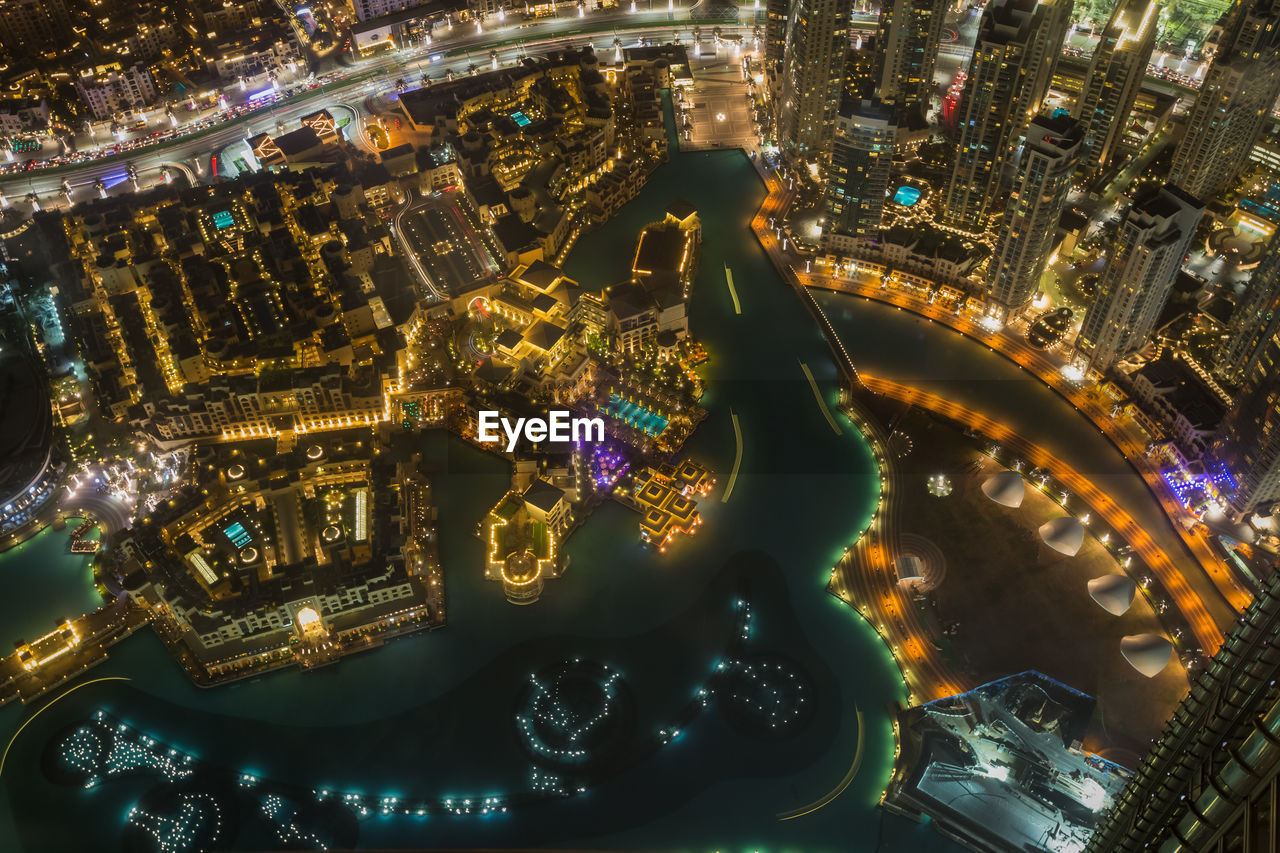 AERIAL VIEW OF ILLUMINATED CITYSCAPE