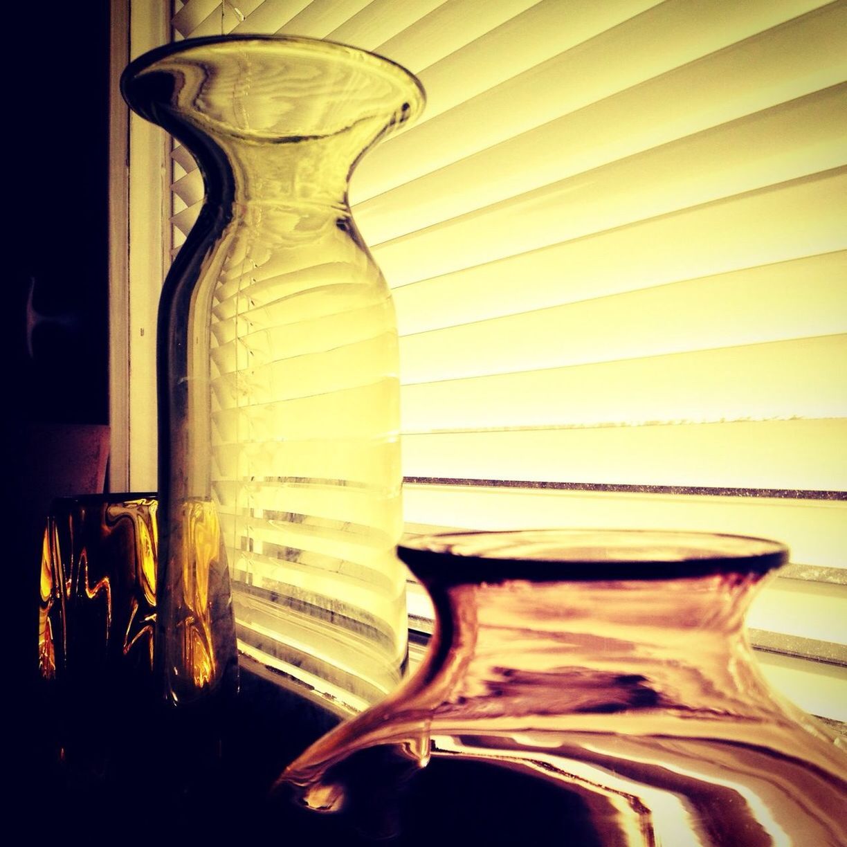 Close-up of glass vase against window