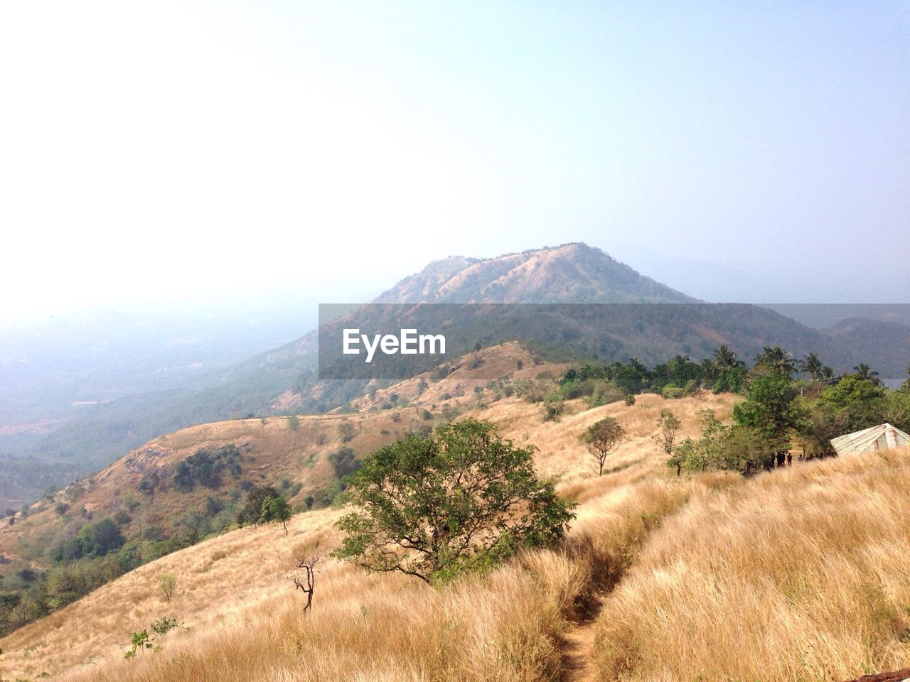 Scenic view of mountains in foggy weather