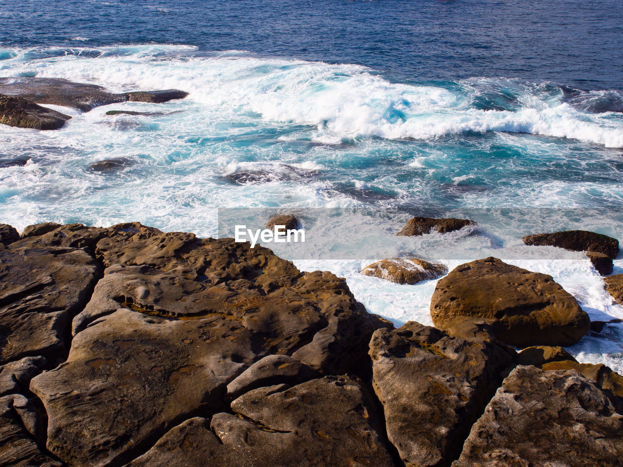 water, sea, rock, land, beach, shore, beauty in nature, coast, wave, ocean, scenics - nature, motion, body of water, wind wave, nature, sports, no people, water sports, cliff, terrain, day, rock formation, outdoors, horizon, tranquility, high angle view, tide pool, bay, tranquil scene, idyllic