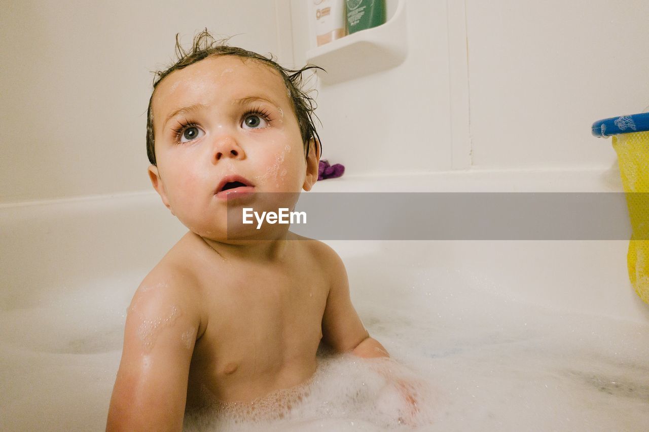 Close up of baby in bath tub