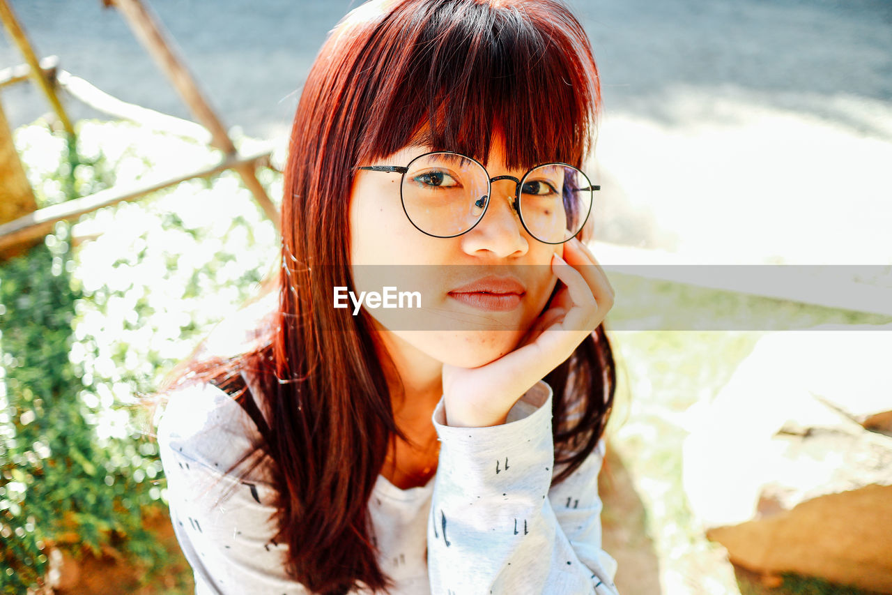 Close-up of young woman looking away