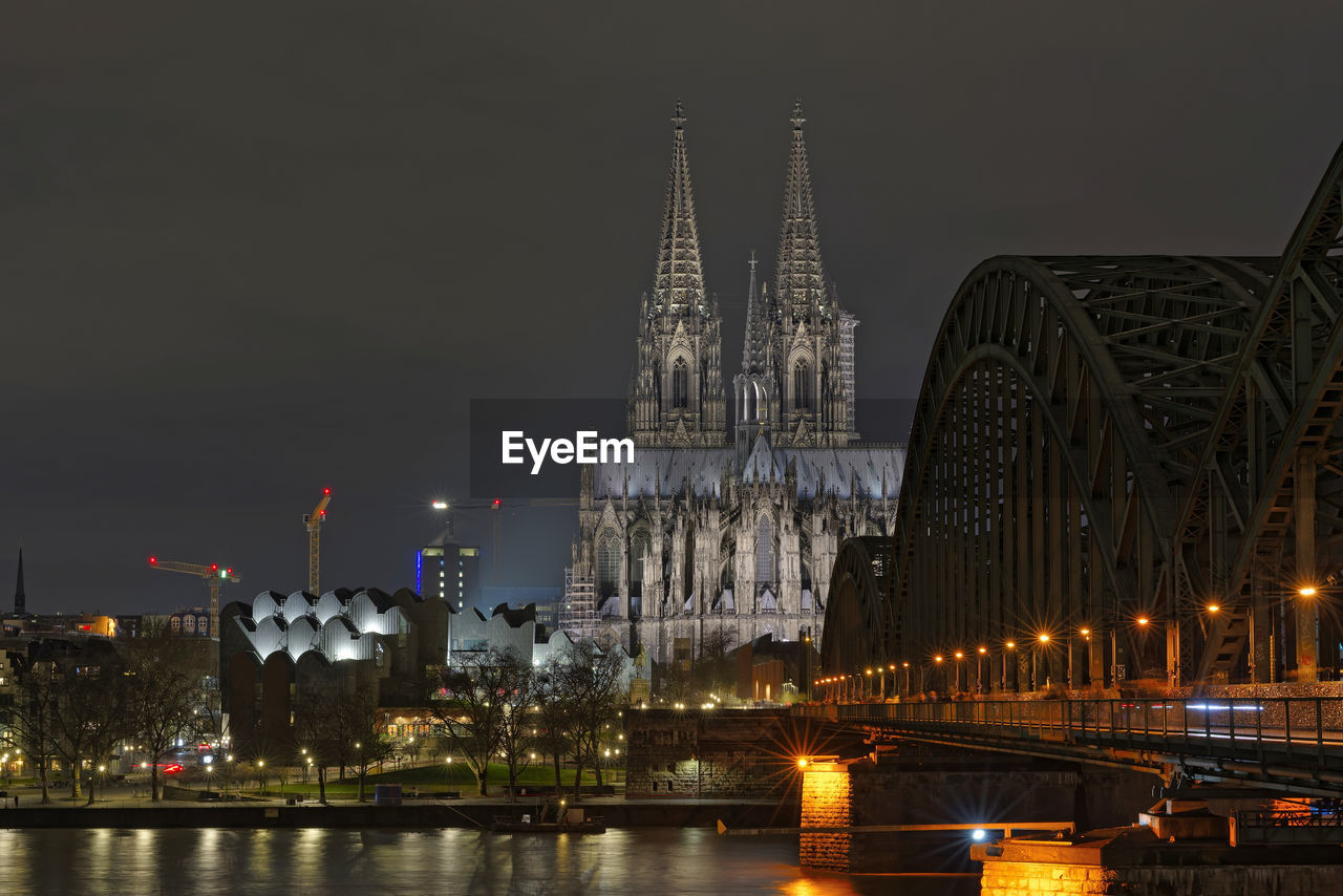 Illuminated buildings in city at night from köln 