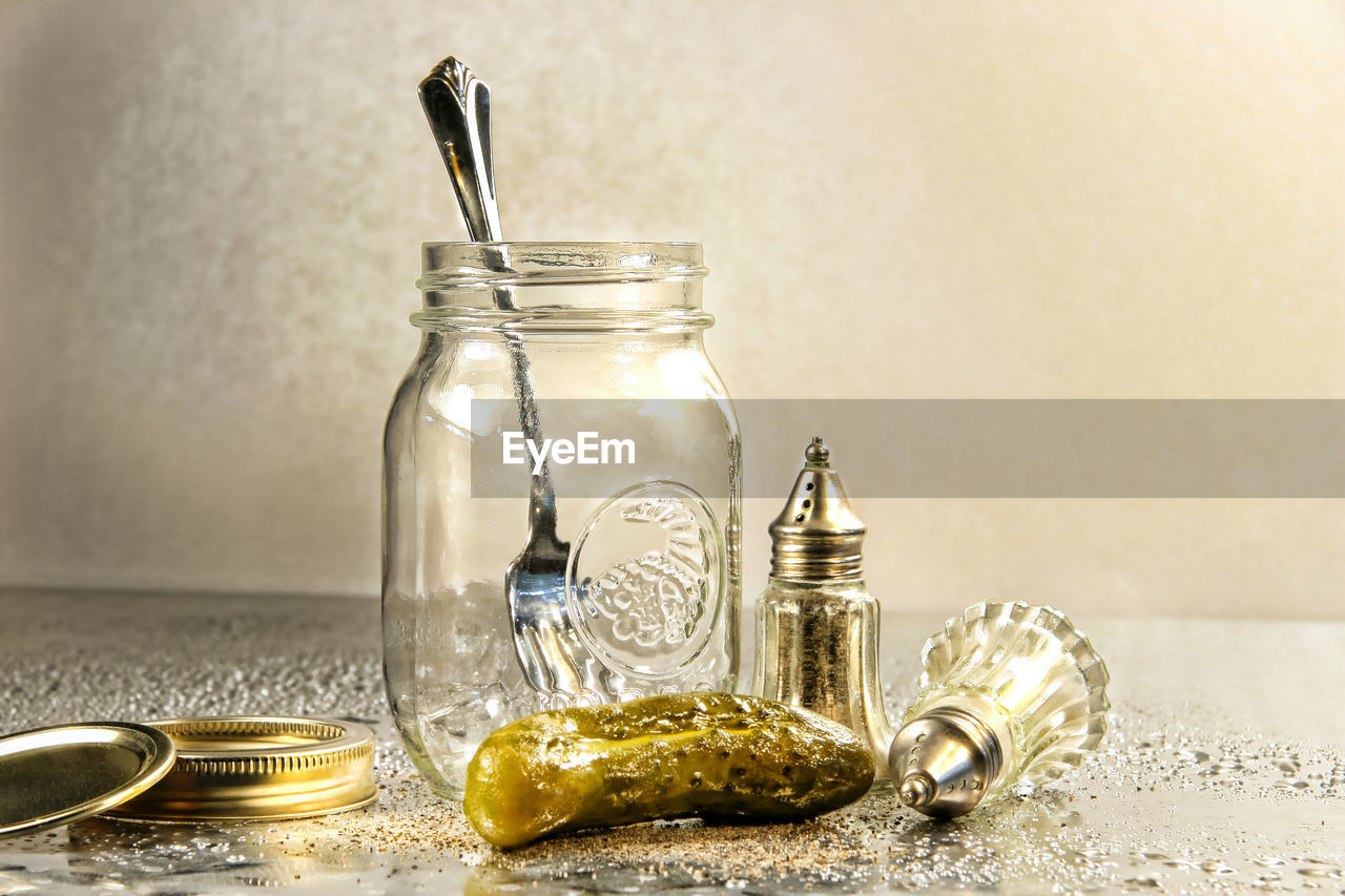 jar, container, indoors, food, food and drink, no people, glass, table, mason jar, bottle, still life, gold, lighting, studio shot, kitchen utensil