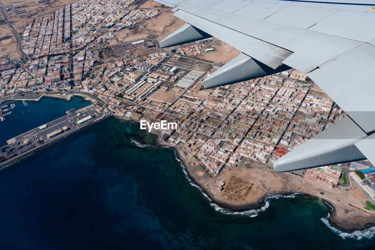 Aerial view through window of plane