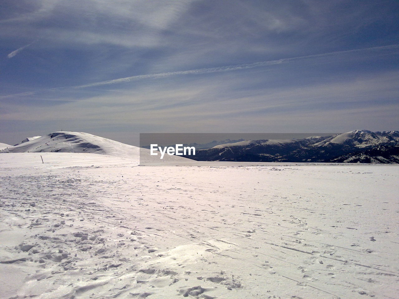 High angle view of ski slope against sky during winter