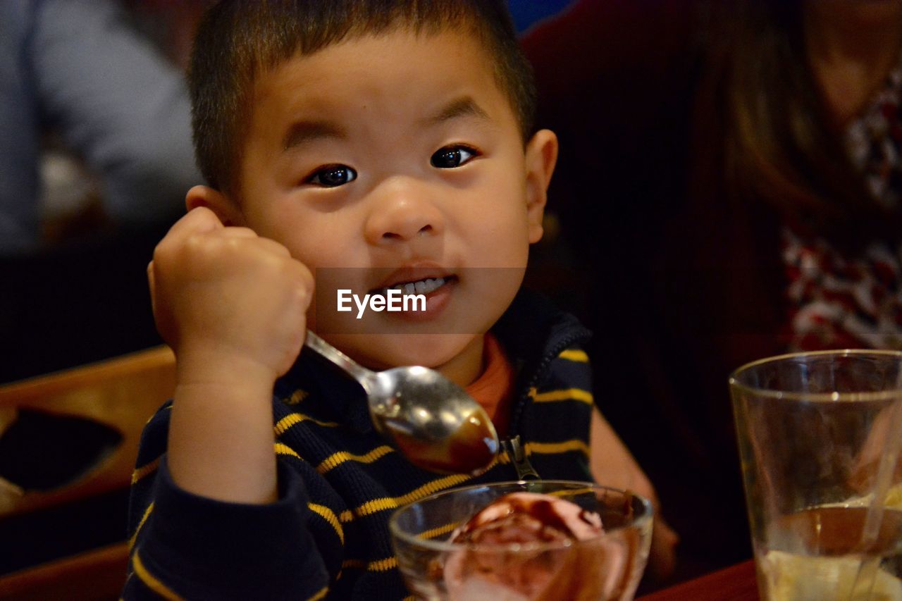 Portrait of cute boy eating ice cream