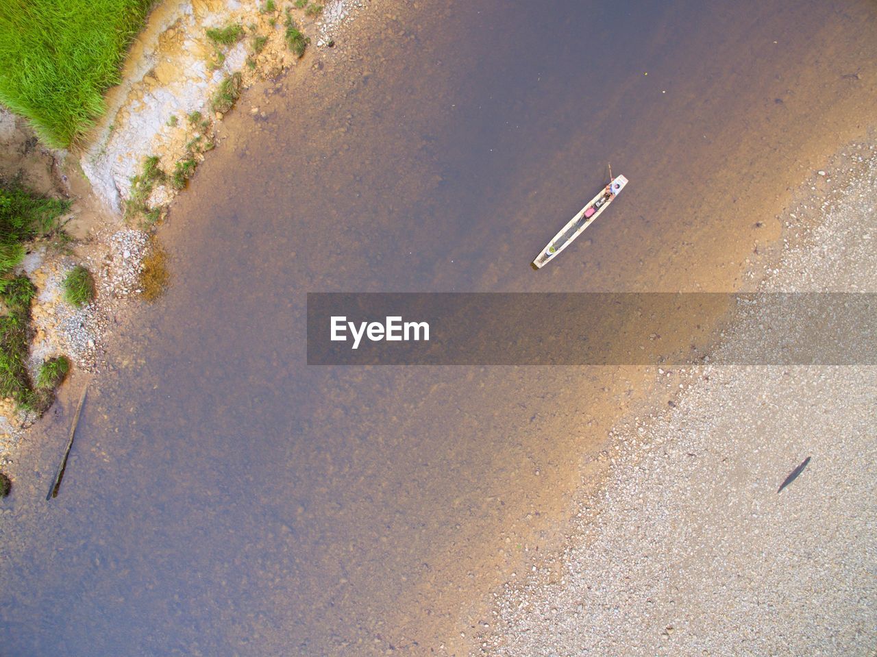 High angle view of boat on riverbank 