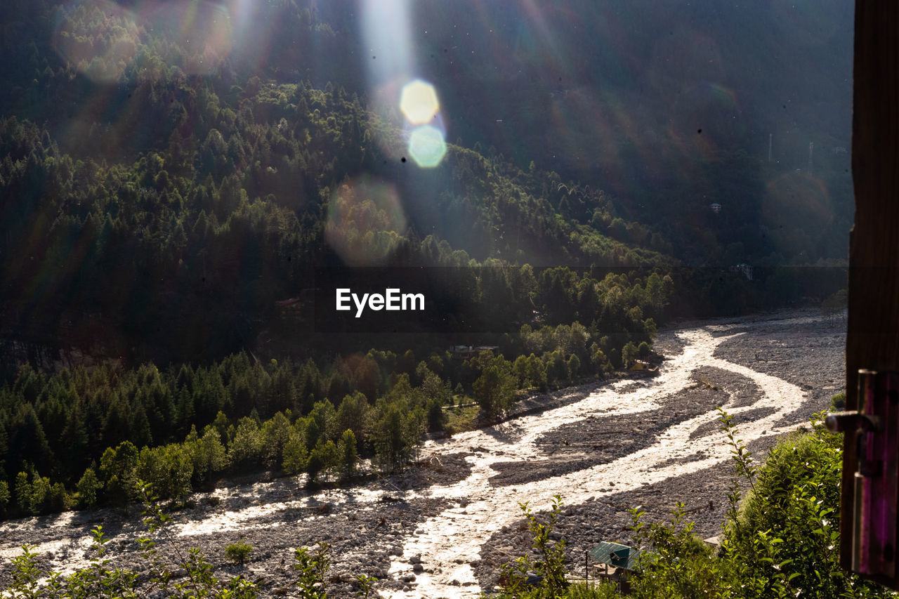 nature, environment, plant, landscape, land, sun, scenics - nature, sunbeam, sunlight, lens flare, beauty in nature, tree, sky, forest, no people, mountain, tranquility, outdoors, light, travel, reflection, water, panoramic, morning, tranquil scene