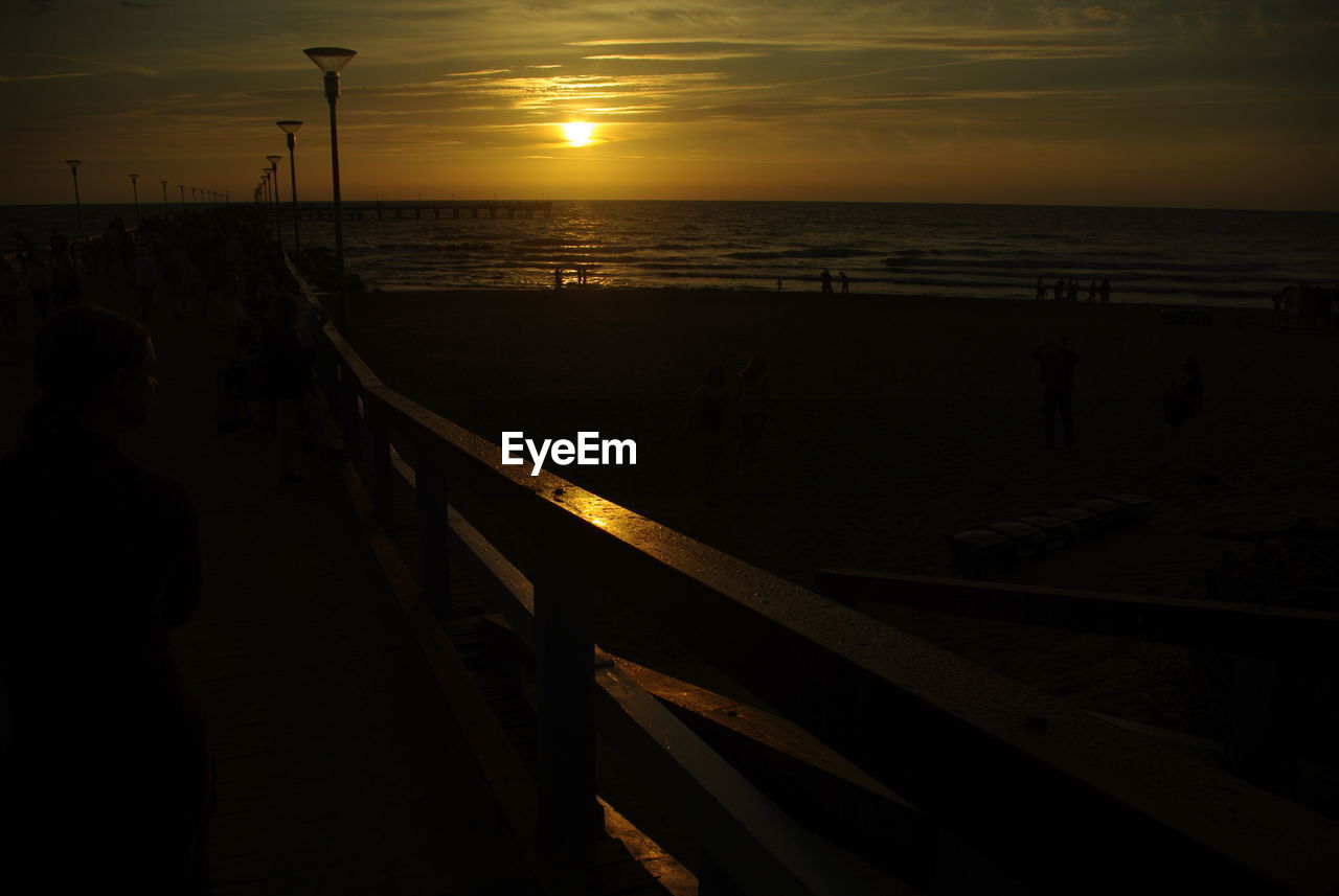 SCENIC VIEW OF SUNSET OVER SEA