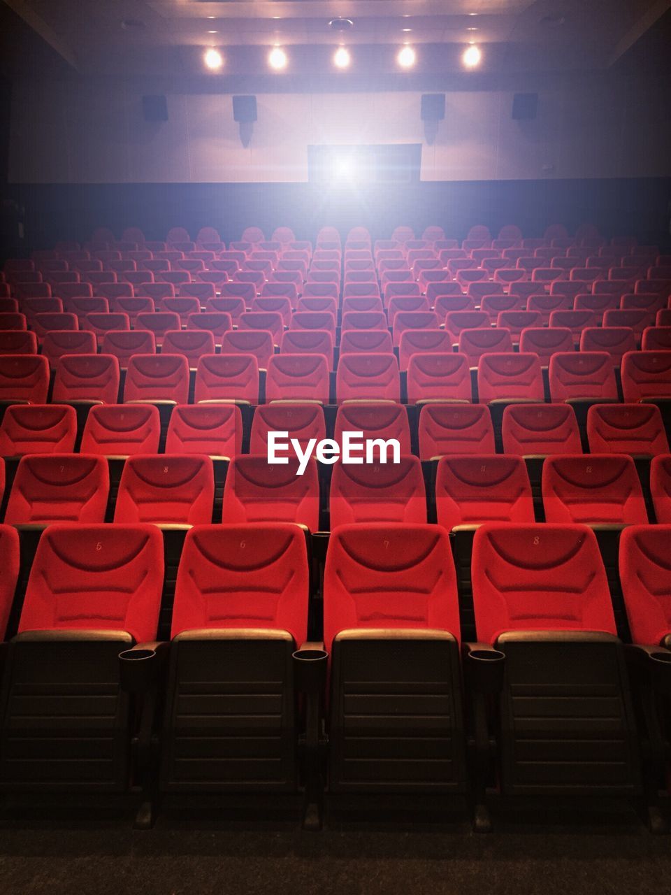 Empty red seats in movie theater