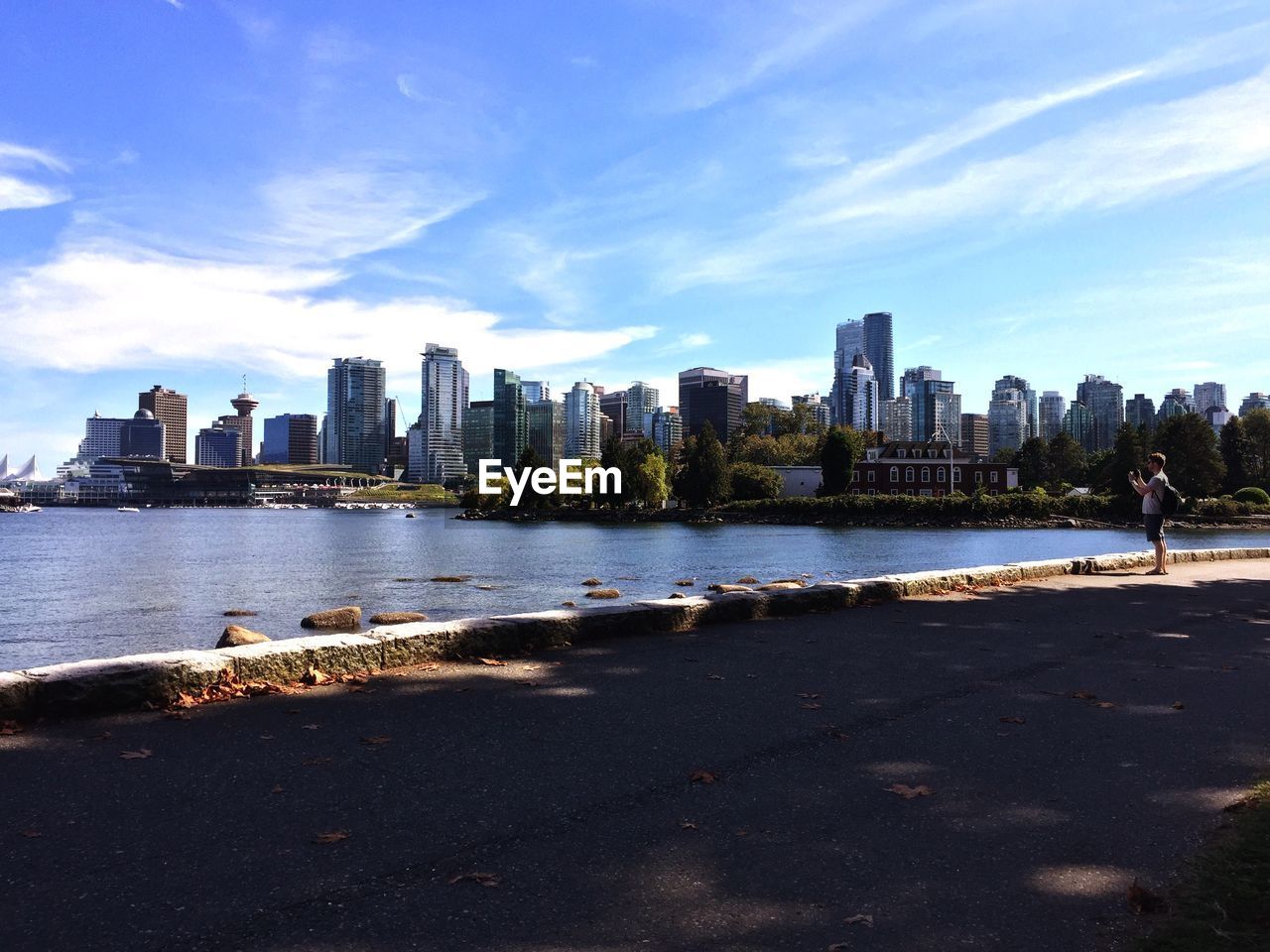 SEA WITH CITYSCAPE IN BACKGROUND