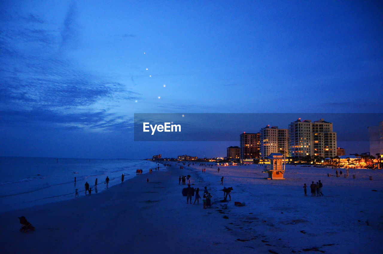 SCENIC VIEW OF BEACH AGAINST BLUE SKY