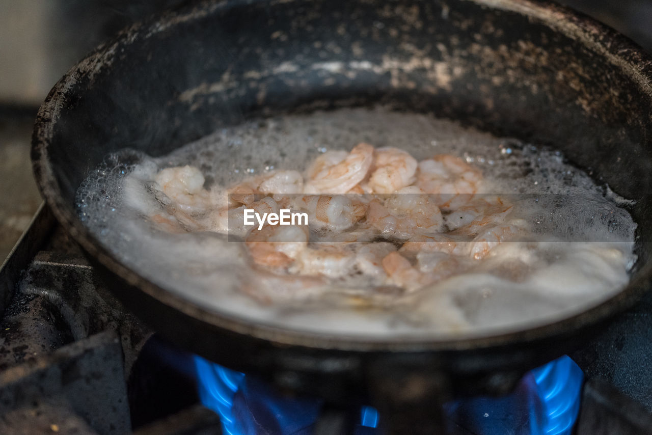 Close-up of meat in cooking pan