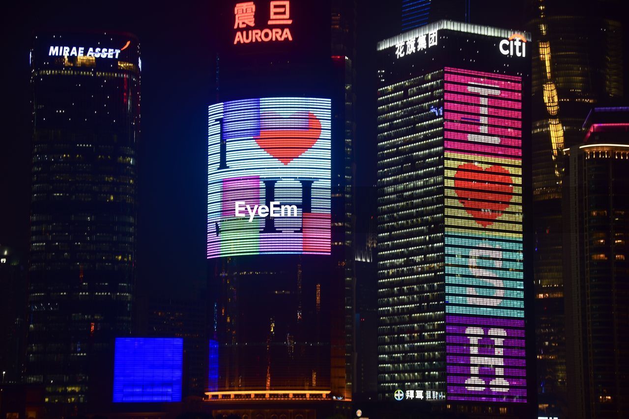 LOW ANGLE VIEW OF ILLUMINATED BUILDING