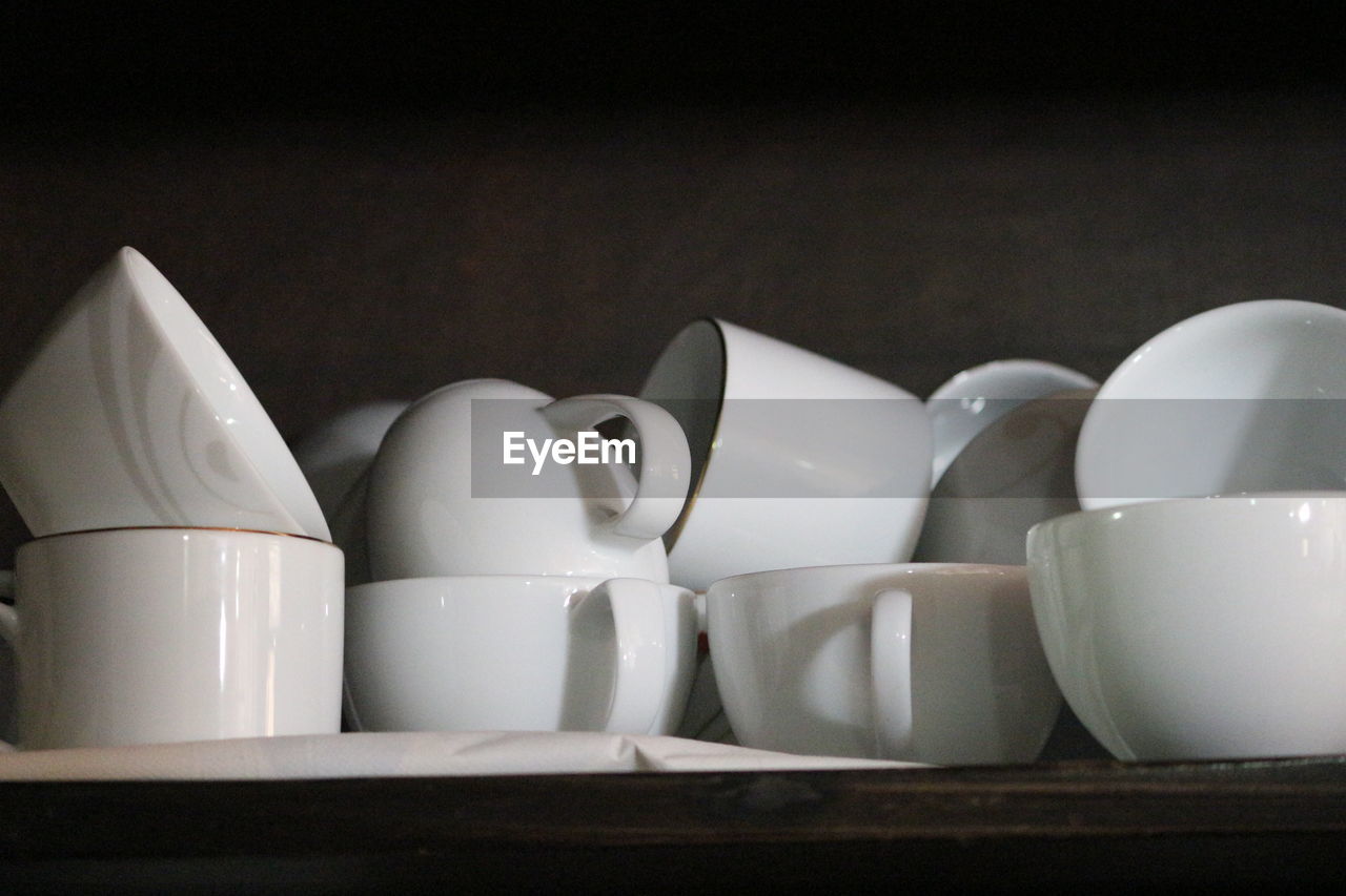 Close-up of coffee cups on table