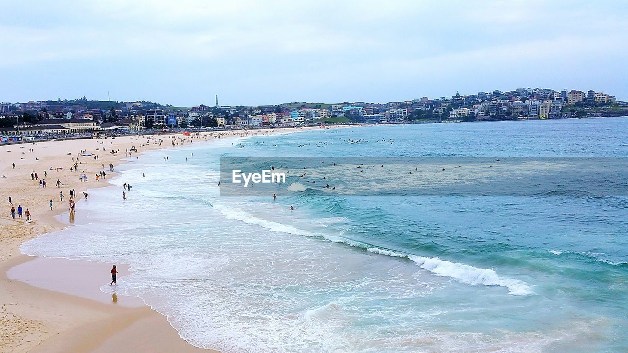 High angle view of people on calm beach