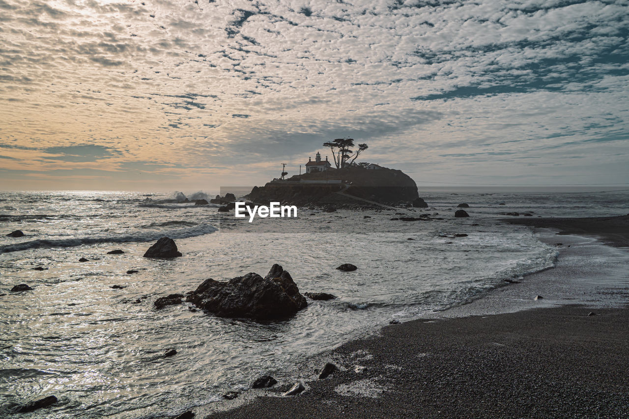 sea, water, beach, land, wave, sky, ocean, nature, coast, sand, shore, beauty in nature, scenics - nature, wind wave, ship, transportation, rock, outdoors, cloud, nautical vessel, sunset, travel, motion, travel destinations, tranquility, no people, horizon, day, vehicle, coastline