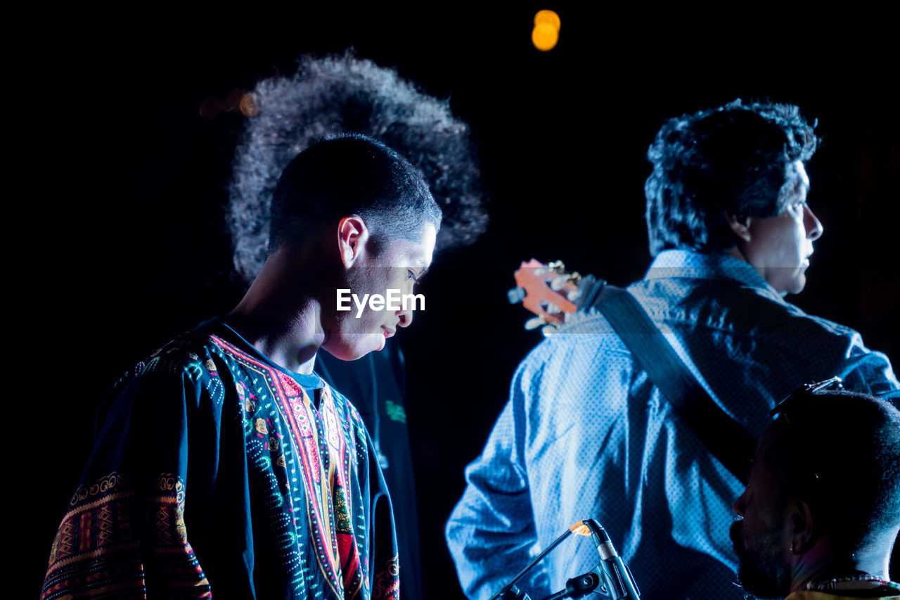 Musicians playing guitar at concert