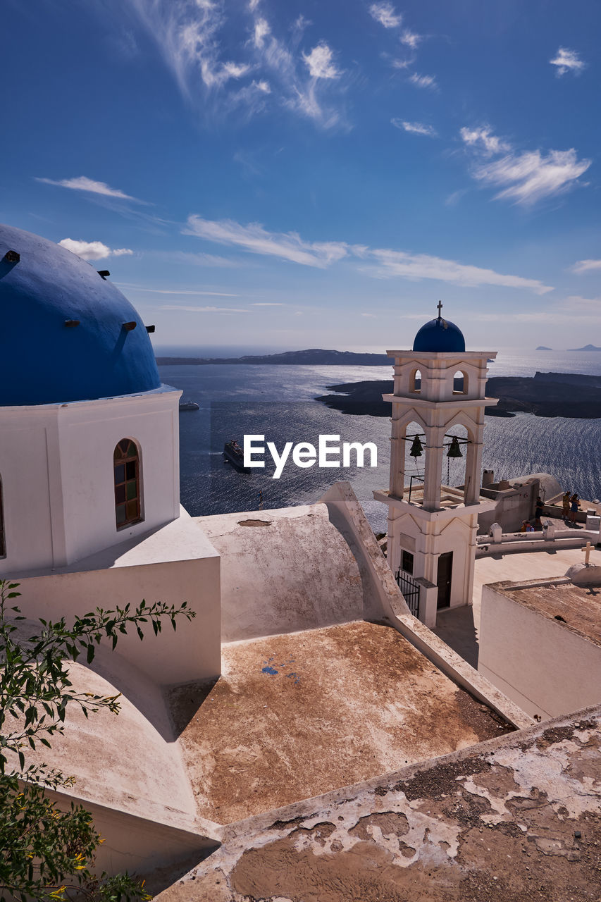 Anastasis church with its blue dome and tower in imerovigli village, santorini, greece