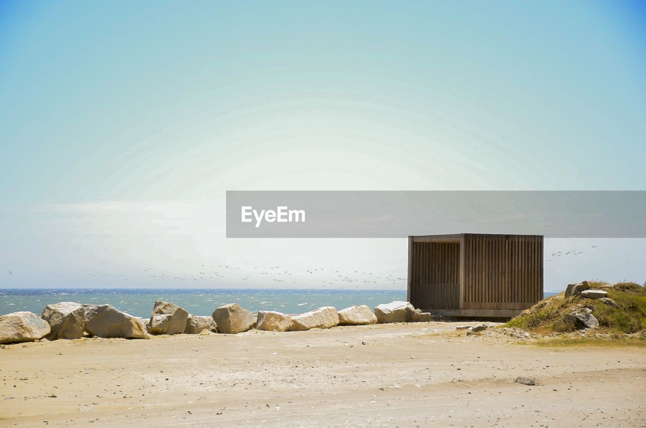 Scenic view of beach against clear sky