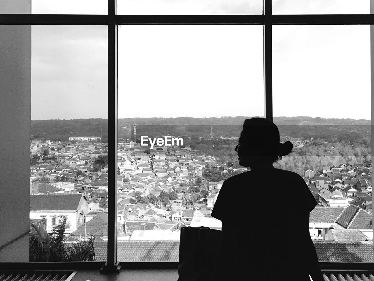 Woman looking at cityscape