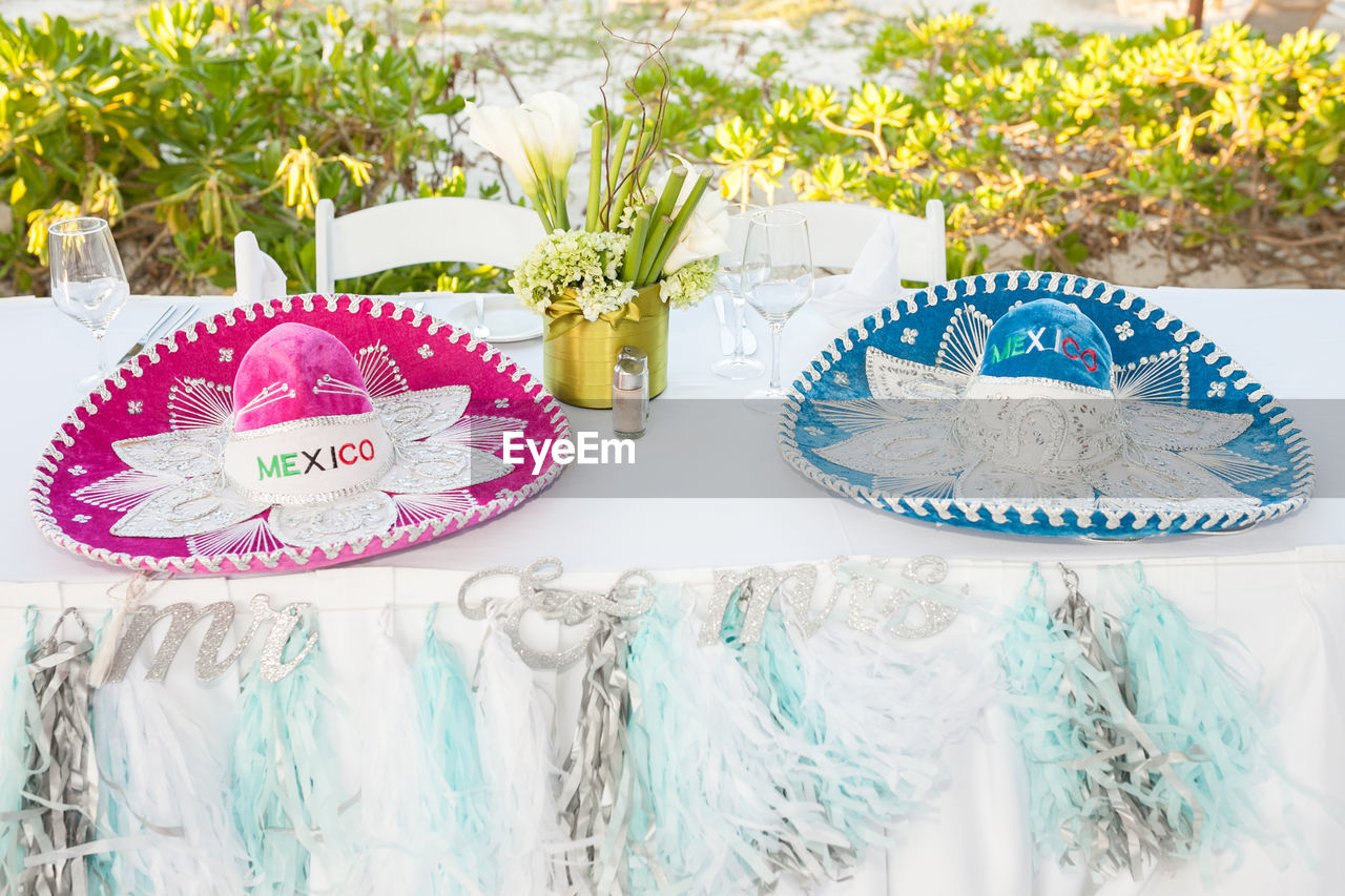 Sombreros on dinning table during wedding