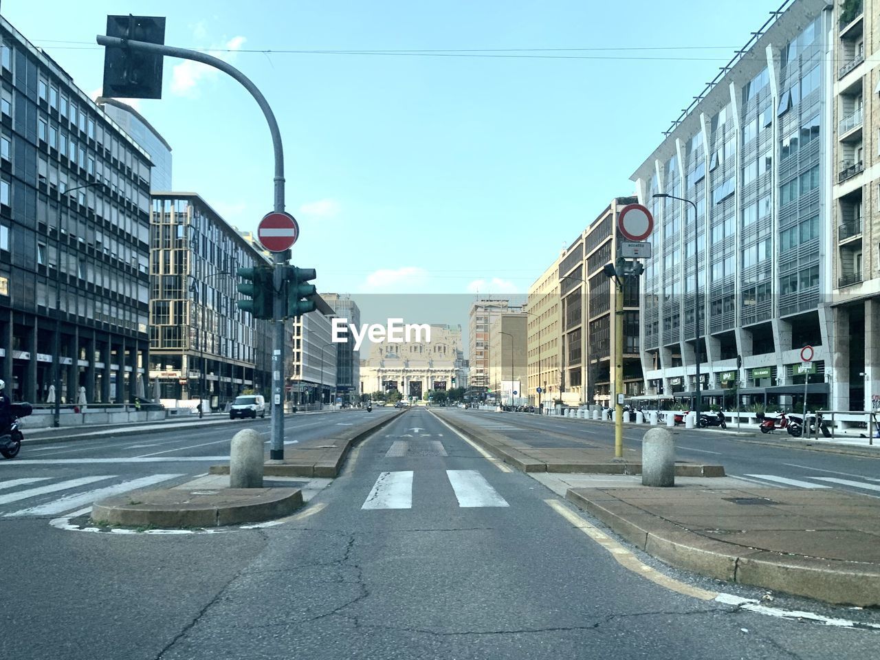 City street and buildings against sky