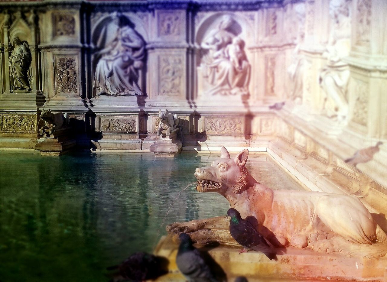 MAN SCULPTURE IN WATER