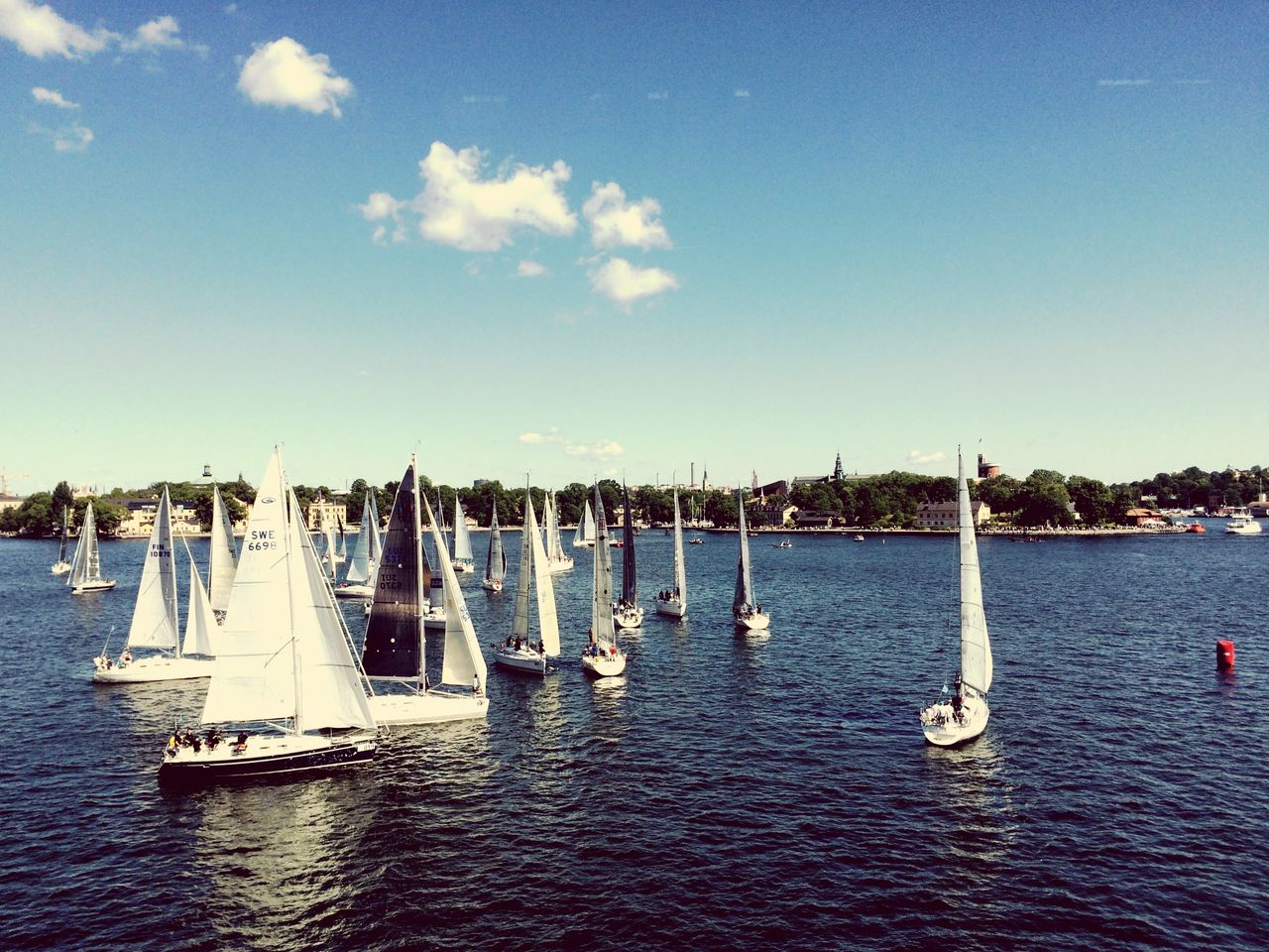 High angle view of sailboats in sea