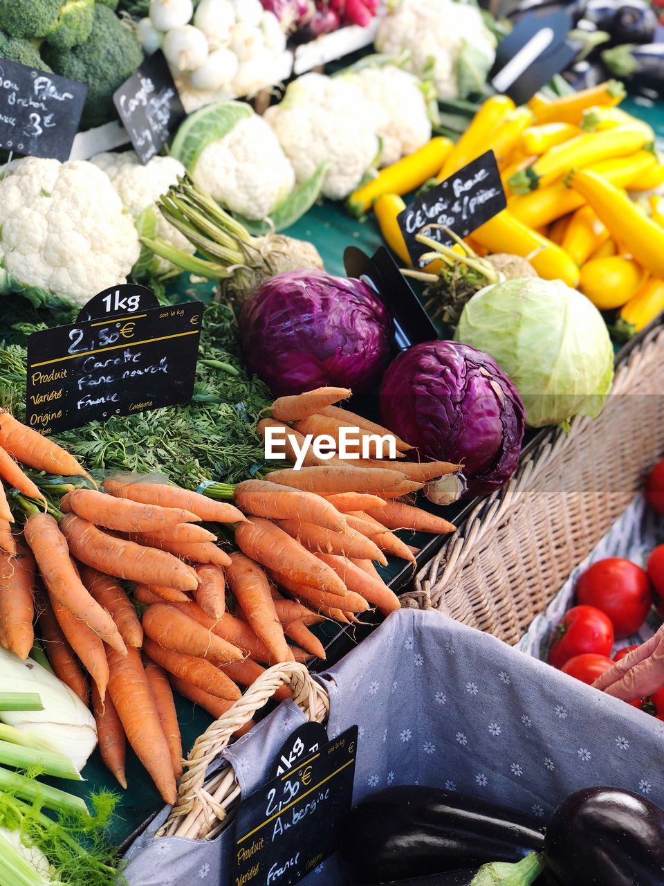 Vegetables with price tag for sale at market stall