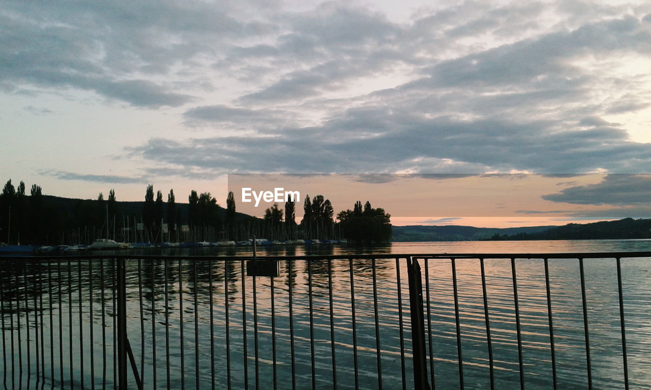 Scenic view of calm lake against sky