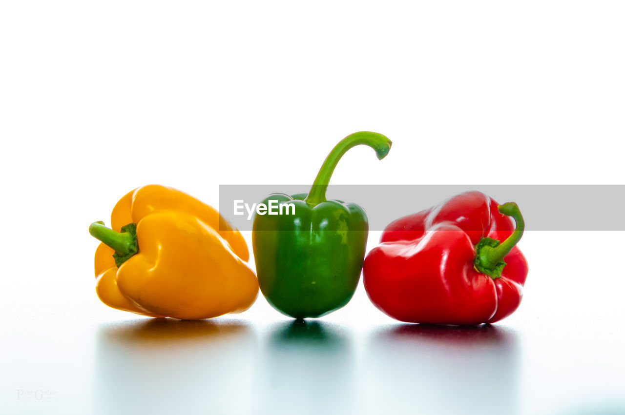 Close-up of bell peppers on white background