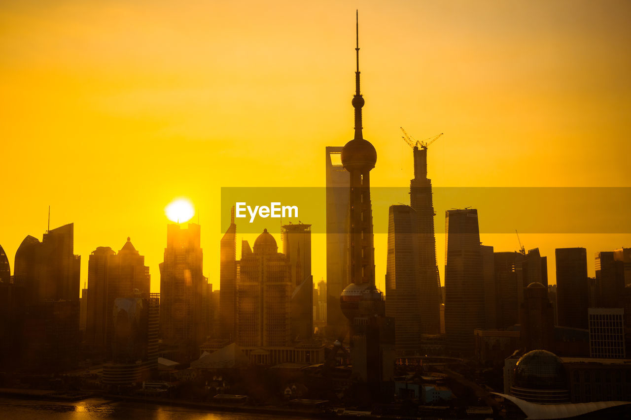 SILHOUETTE OF BUILDINGS DURING SUNSET