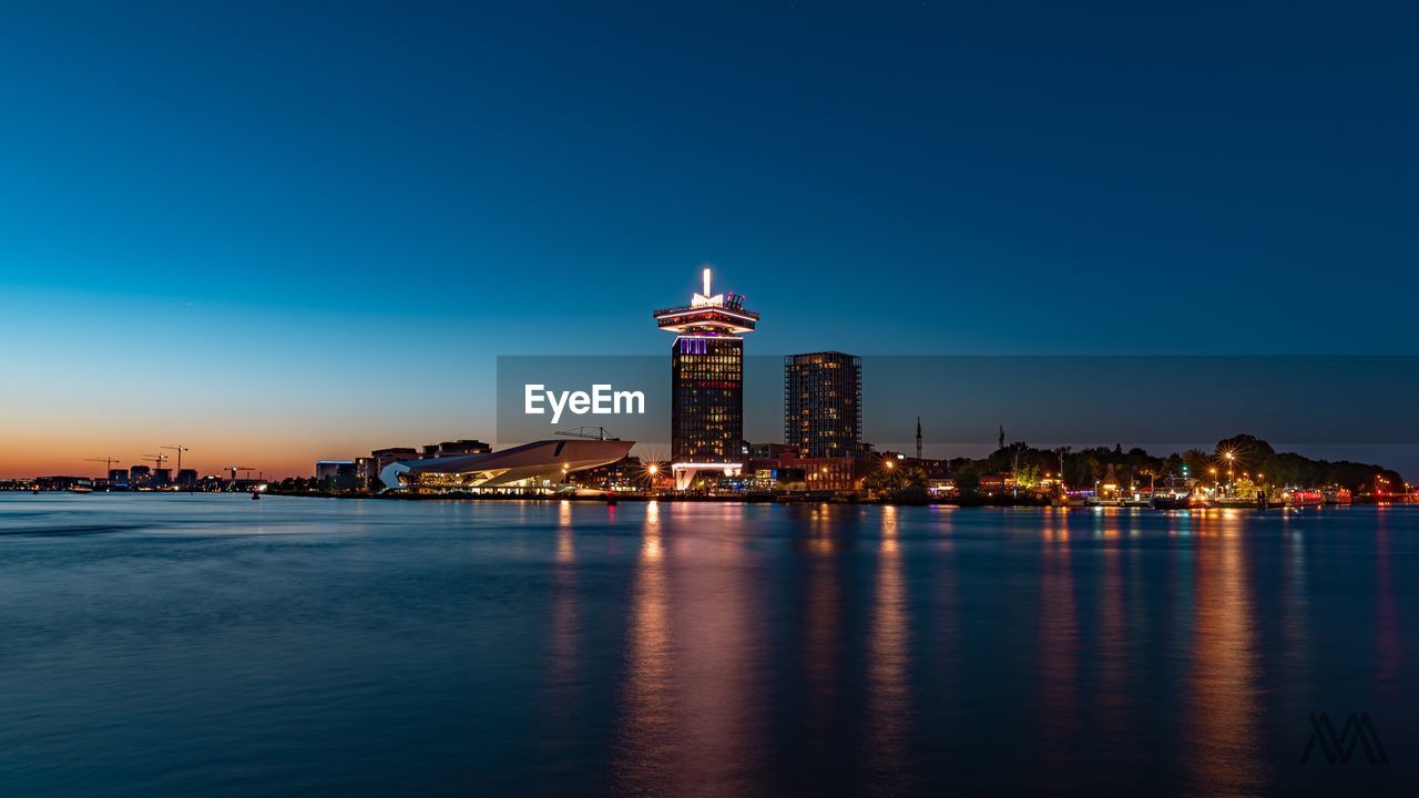 Illuminated buildings in city at night