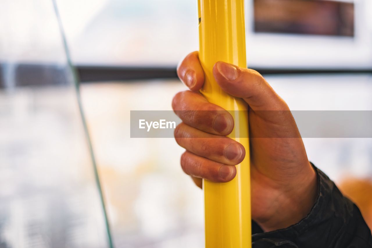 Close-up of a hand holding pole