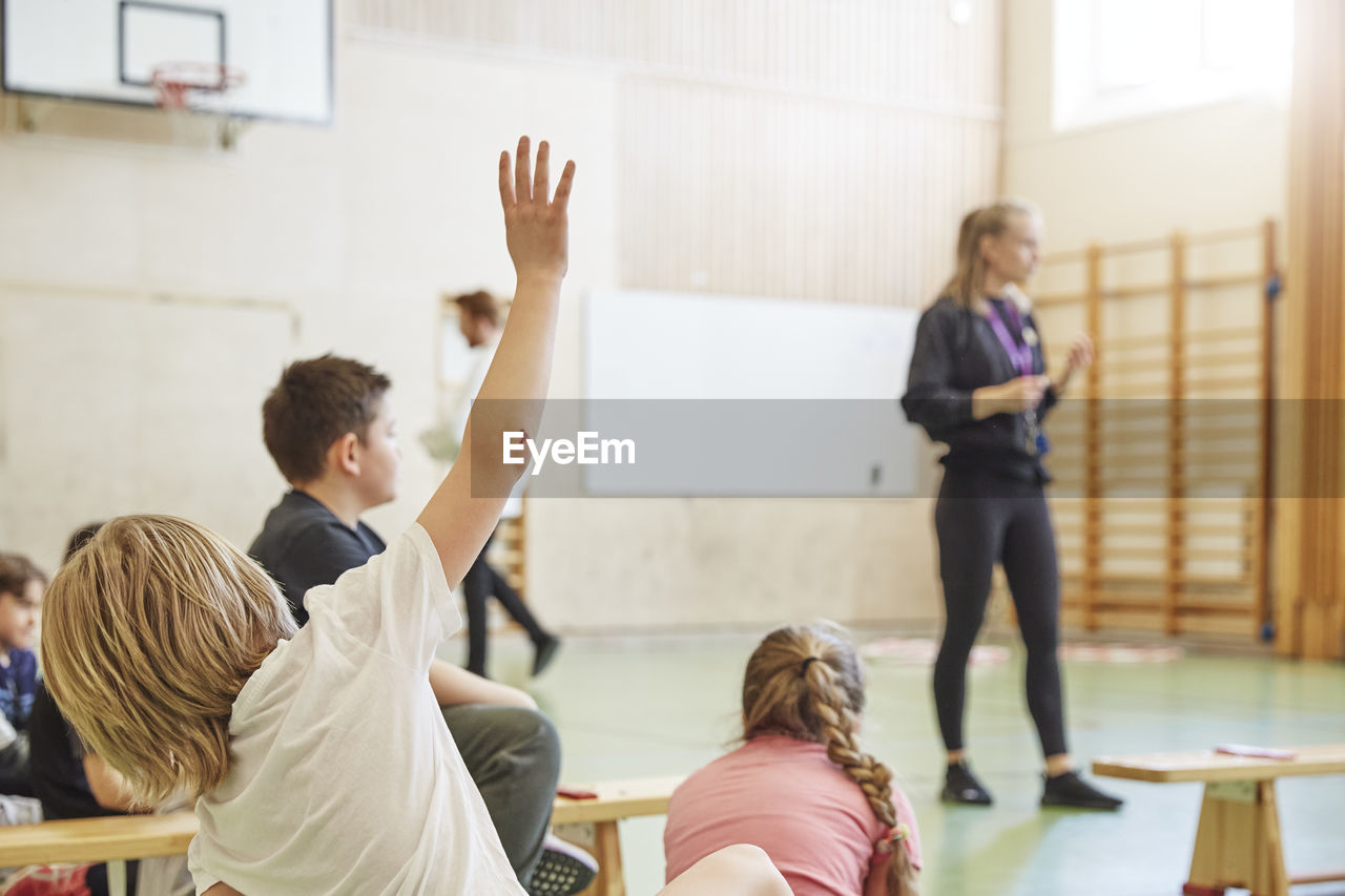 Children having class in school gym