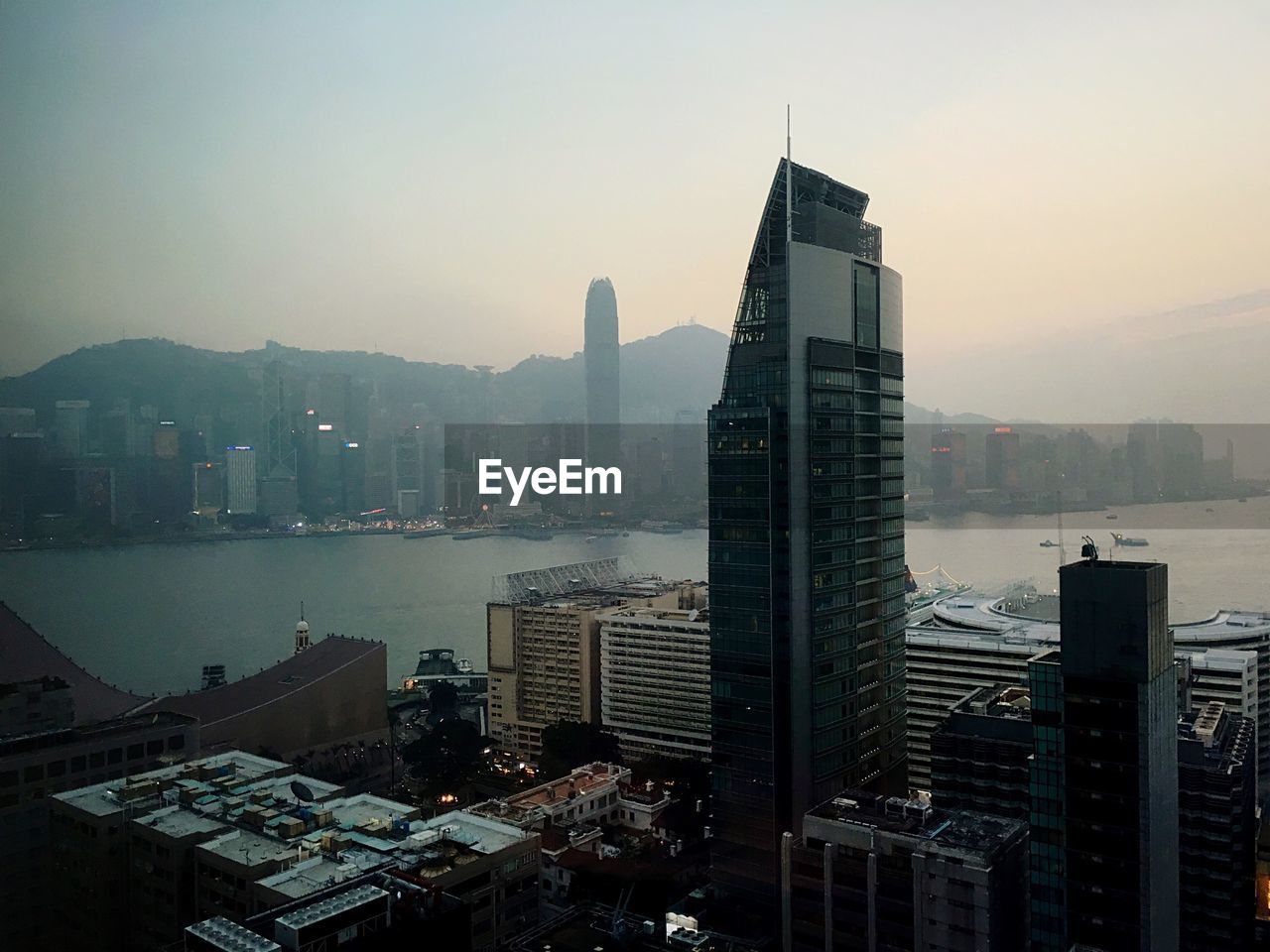 High angle view of buildings amidst sea against clear sky