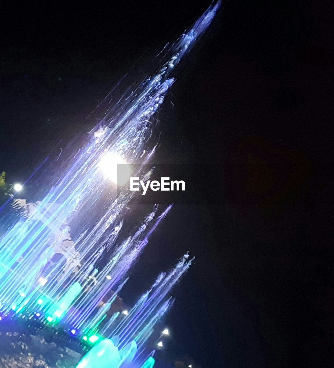 LOW ANGLE VIEW OF ILLUMINATED TUNNEL