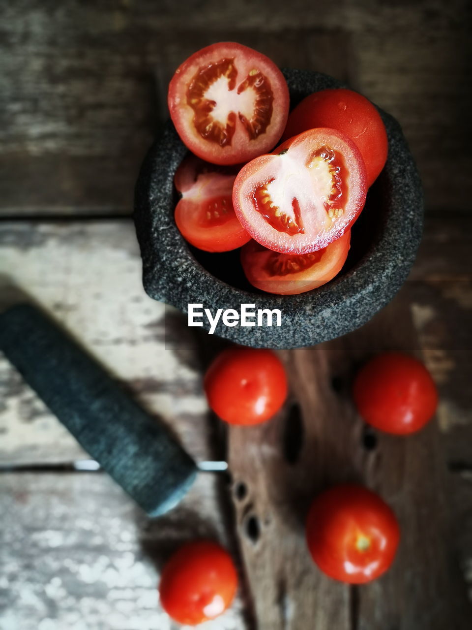 HIGH ANGLE VIEW OF FRUITS IN CONTAINER ON TABLE