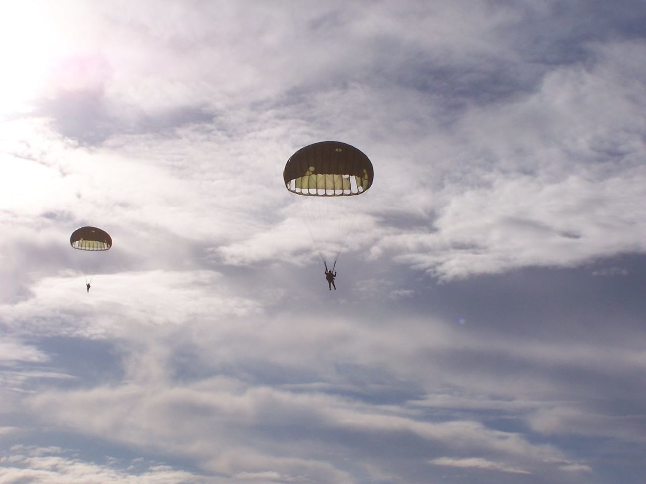 Low angle view of people parachuting