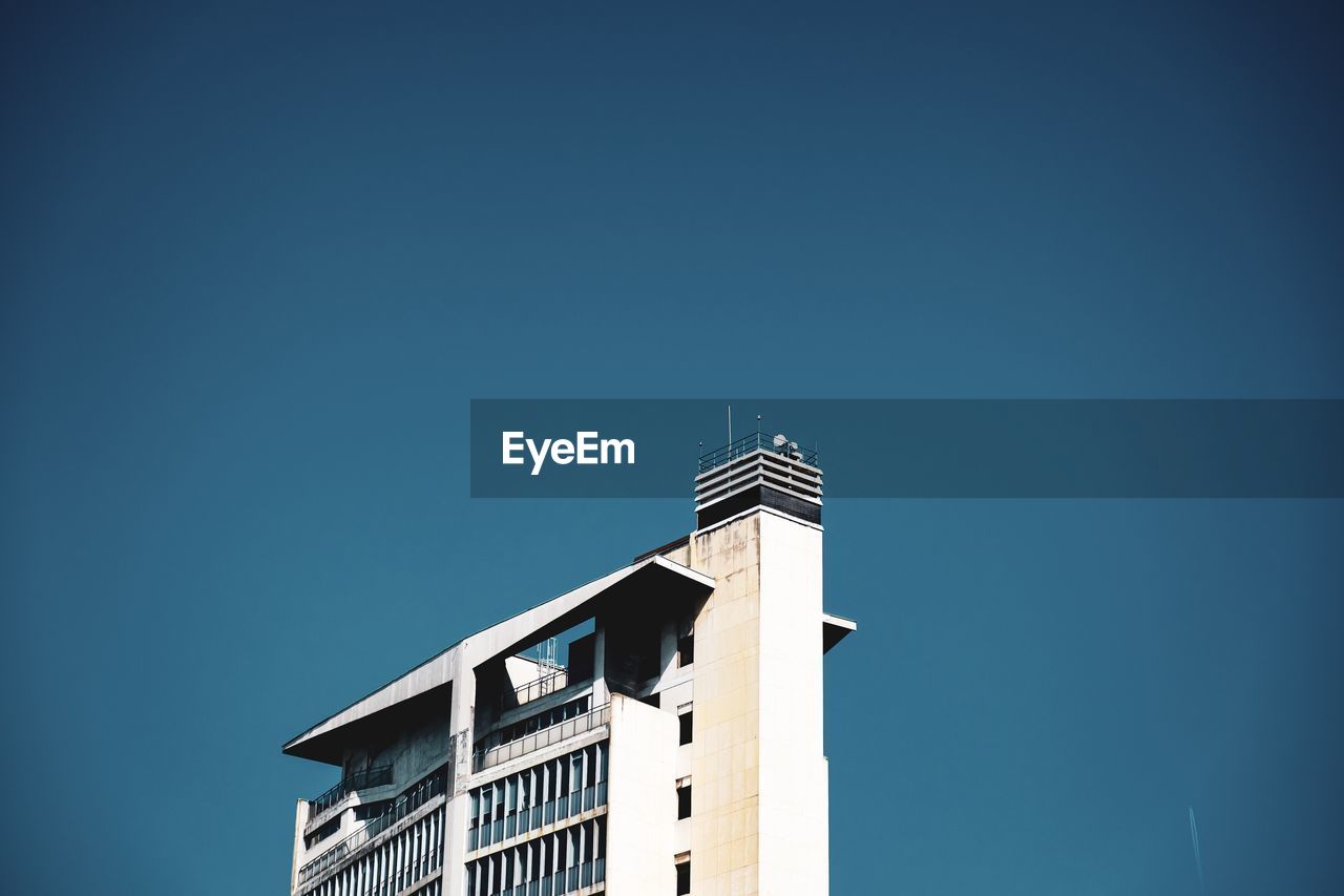 Low angle view of building against blue sky