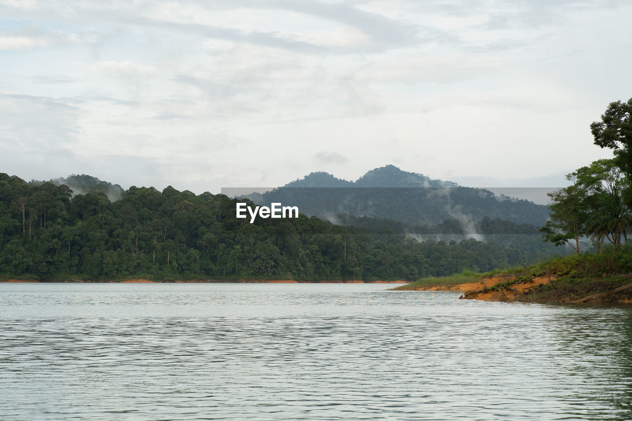 SCENIC VIEW OF RIVER AND MOUNTAINS AGAINST SKY