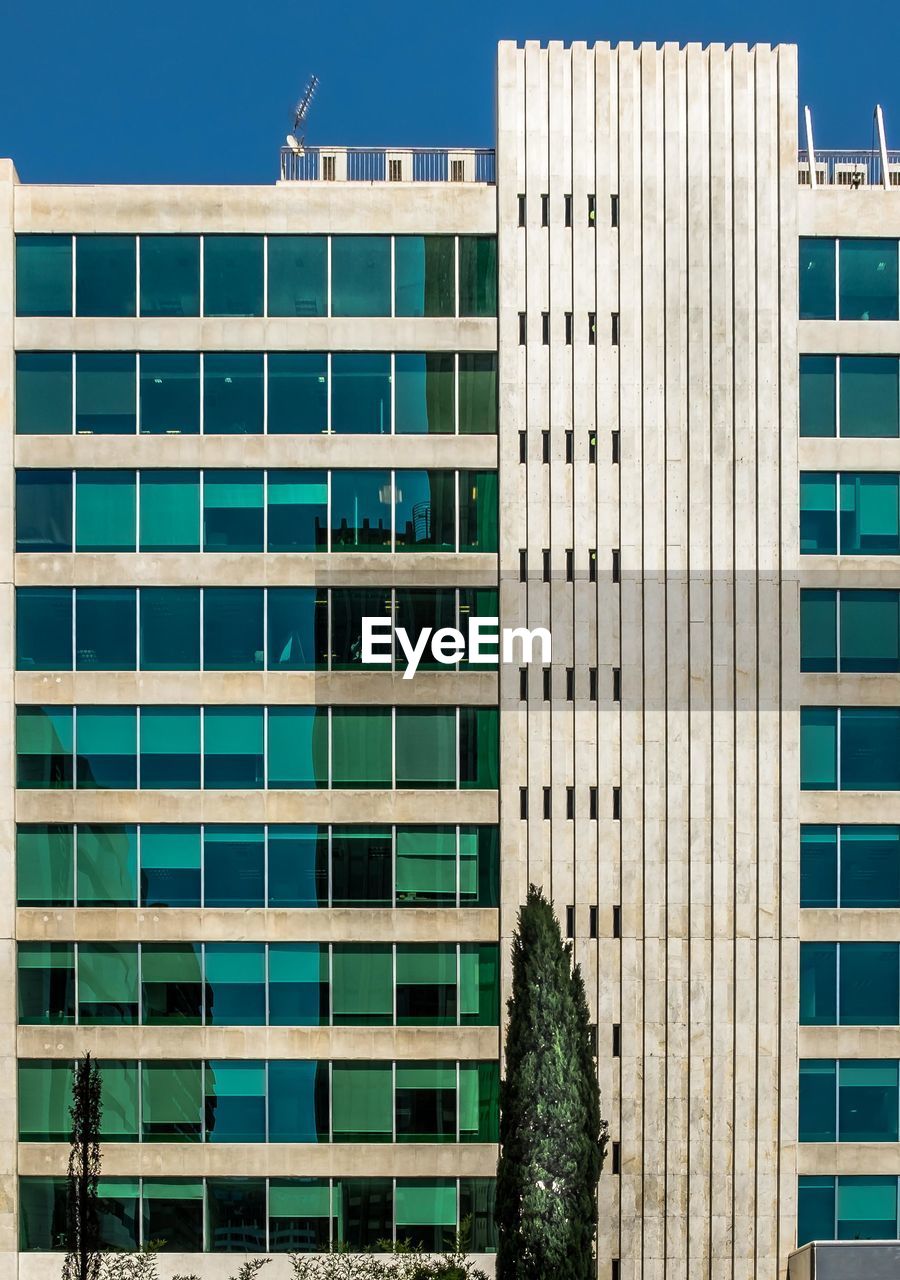 Modern office building against clear sky