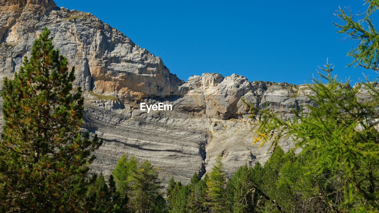 Scenic view of rocky mountains against clear sky