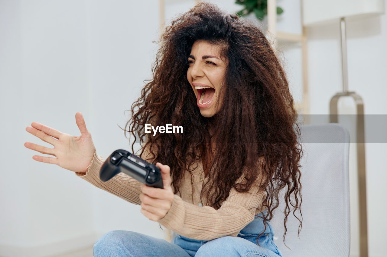 Smiling girl playing video game