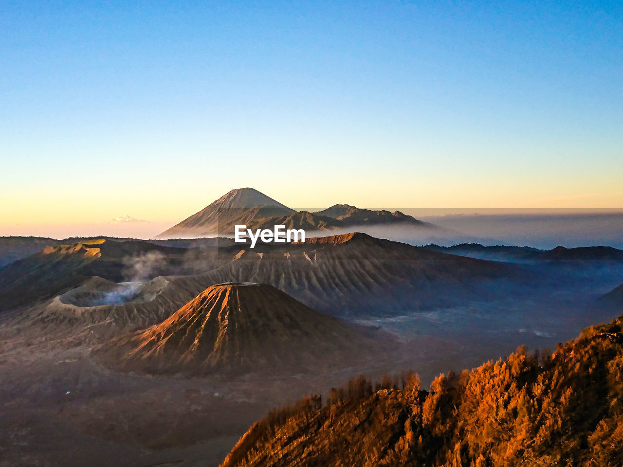 View of volcanic mountain against sky during sunset