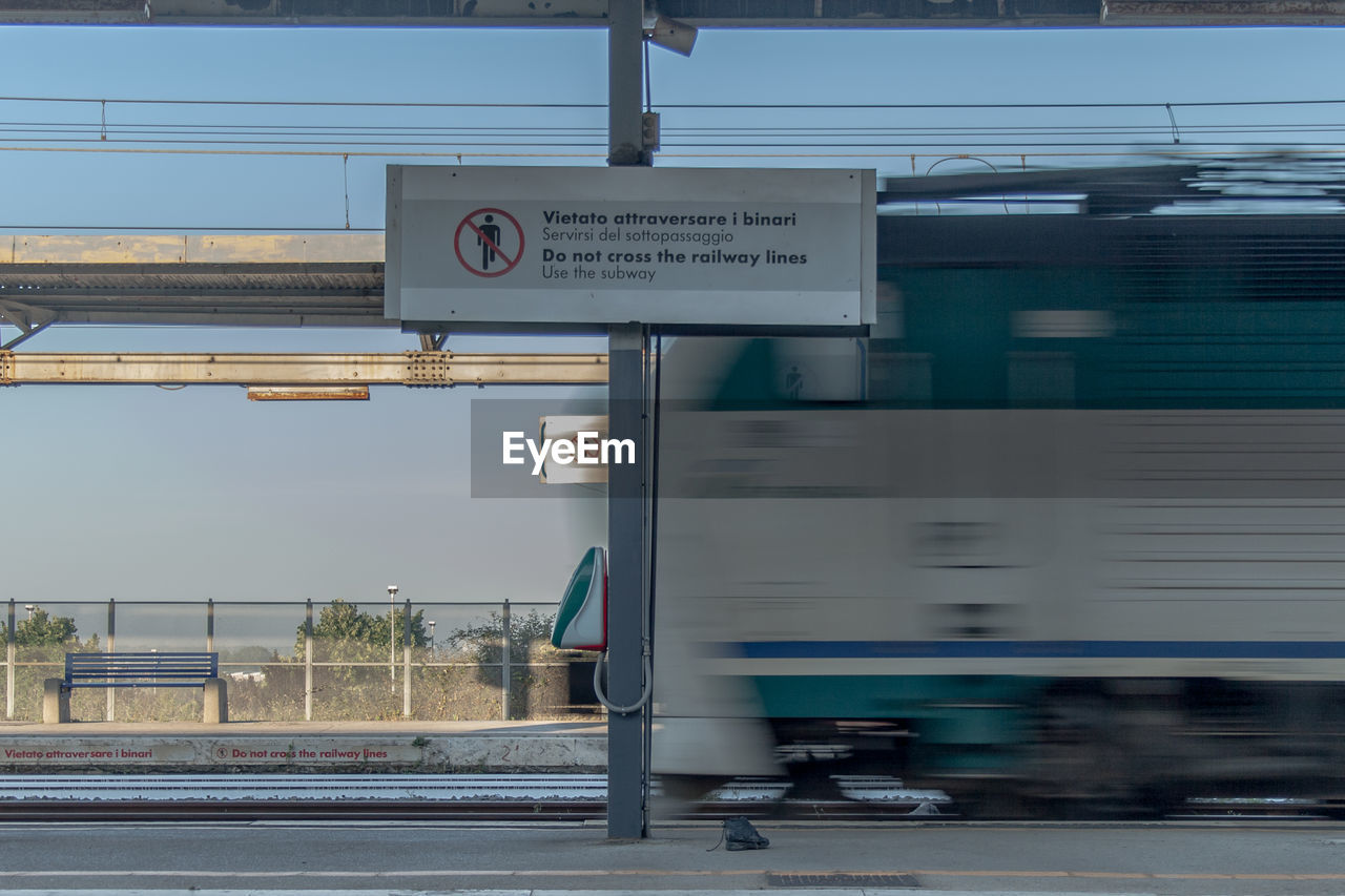 Blurred motion of train at railroad station